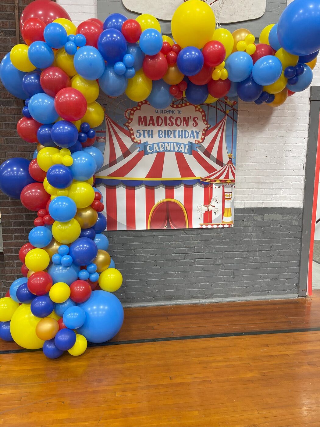 Bright carnival-themed organic balloon garland