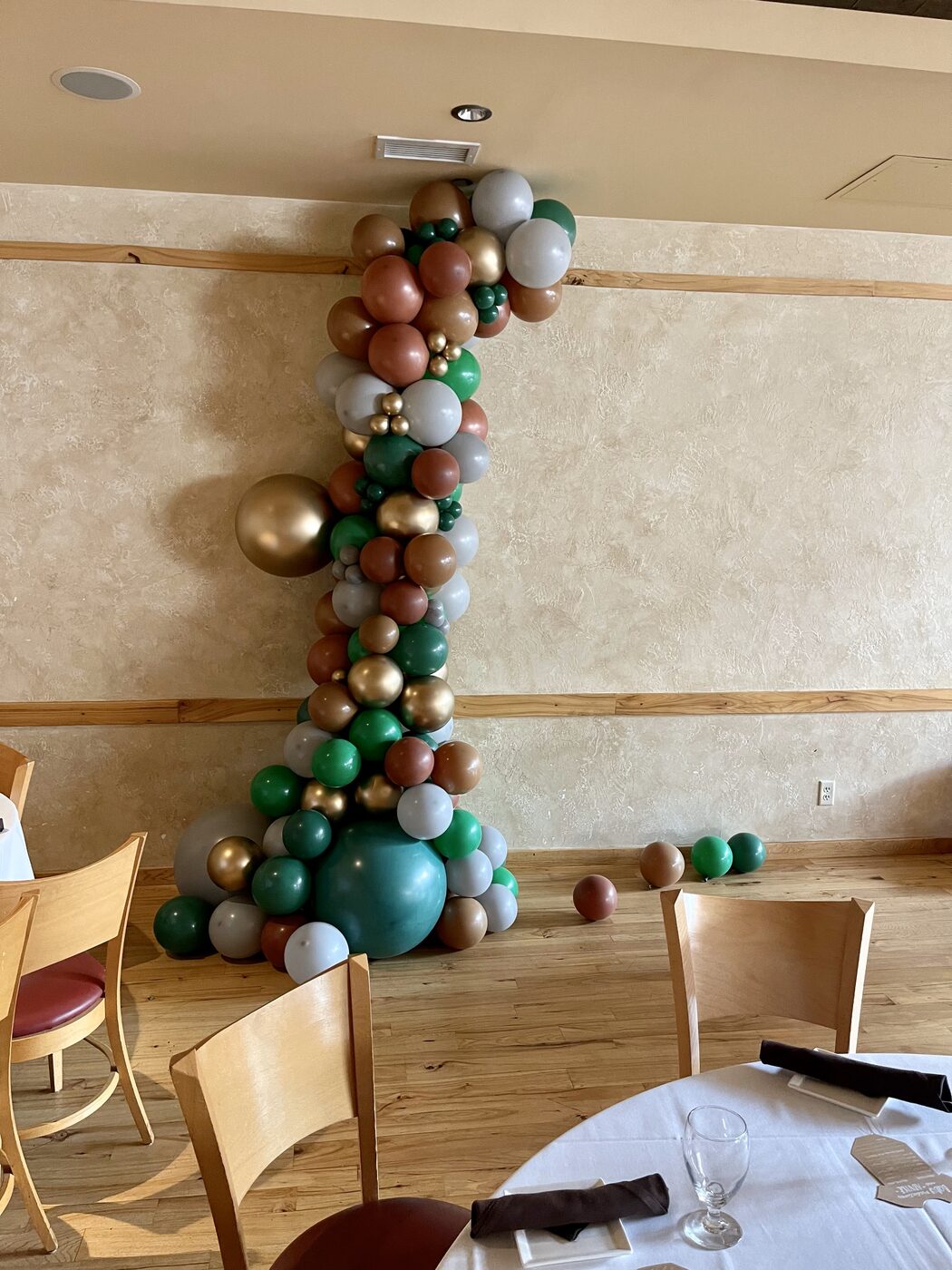 Tall organic balloon garland installation